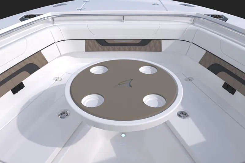 Slide: The Image of 2024 Blackfin 252DC boat interior with round table and seating area. - 17