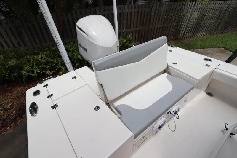 Slide: The Image of 2021 Robalo 246 Cayman SD boat with Yamaha outboard motor and rear seating. - 15