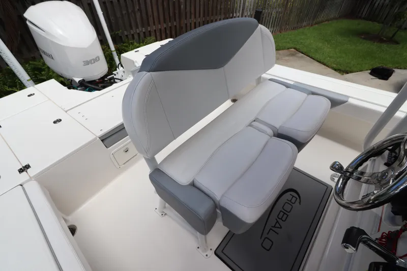 Slide: The Image of 2021 Robalo 246 Cayman SD boat seating and helm area. - 21