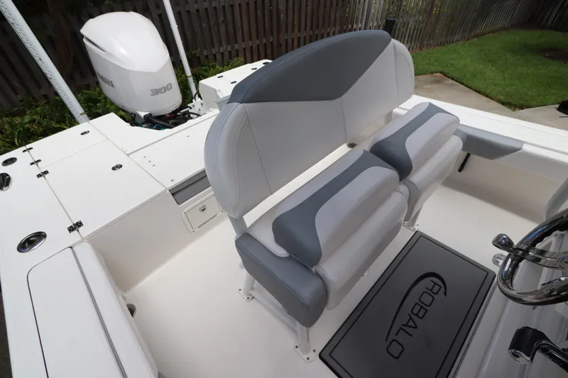 Slide: The Image of 2021 Robalo 246 Cayman SD boat interior with dual seating and Yamaha 300 engine. - 22