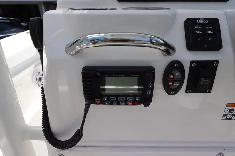 Slide: The Image of Control panel of 2021 Robalo 246 Cayman SD boat with radio and switches. - 28