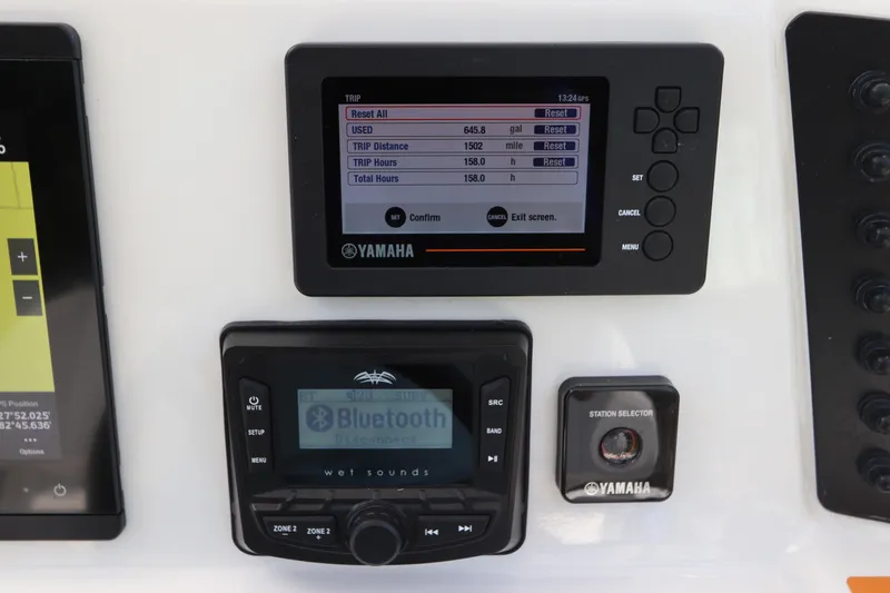 Slide: The Image of Yamaha control panel and Bluetooth audio system on 2021 Robalo 246 Cayman SD boat. - 29