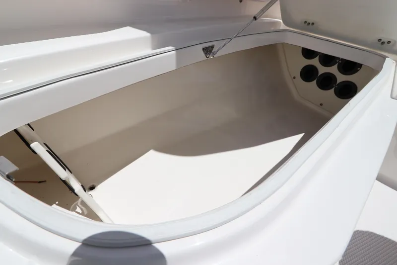 Slide: The Image of Spacious storage compartment in the 2021 Robalo 246 Cayman SD boat. - 33
