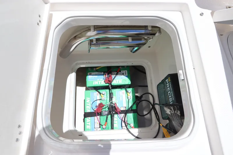Slide: The Image of Battery compartment of a 2021 Robalo 246 Cayman SD boat. - 35