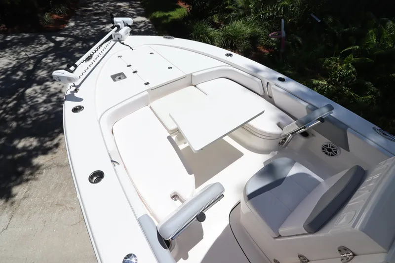 Slide: The Image of 2021 Robalo 246 Cayman SD boat with spacious seating and table. - 39
