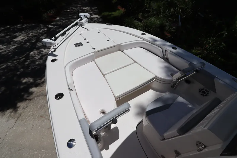 Slide: The Image of 2021 Robalo 246 Cayman SD boat interior with cushioned seating. - 41