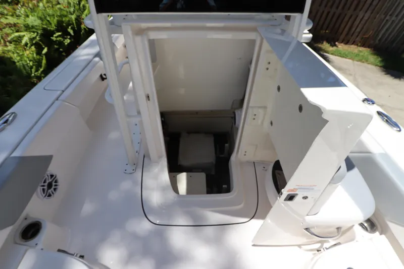 Slide: The Image of 2021 Robalo 246 Cayman SD boat interior storage compartment open. - 43