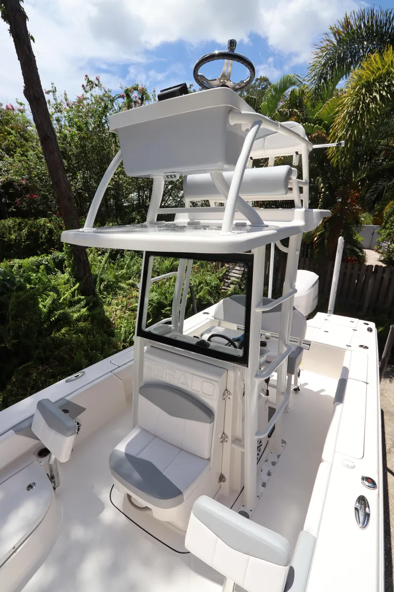 Slide: The Image of 2021 Robalo 246 Cayman SD boat with dual console and upper helm station. - 45