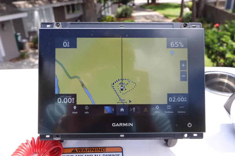 Slide: The Image of Garmin navigation system on a 2021 Robalo 246 Cayman SD boat. - 48