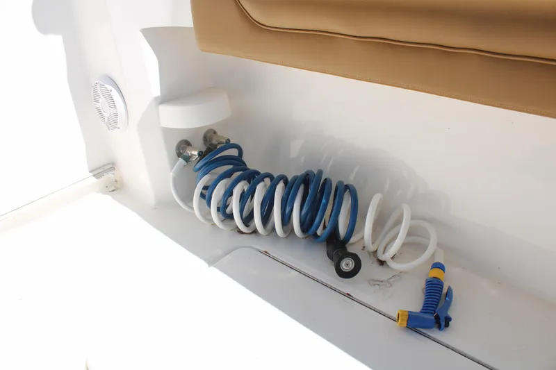 Slide: The Image of Coiled hose on 2021 Albemarle 30 Express boat deck, near seating area. - 37