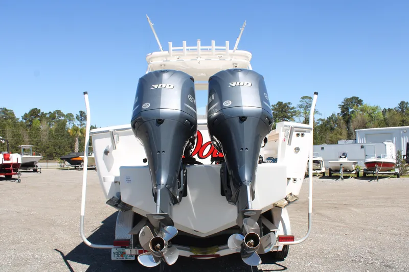 Slide: The Image of 2021 Albemarle 30 Express boat with dual 300 horsepower outboard engines, rear view. - 4