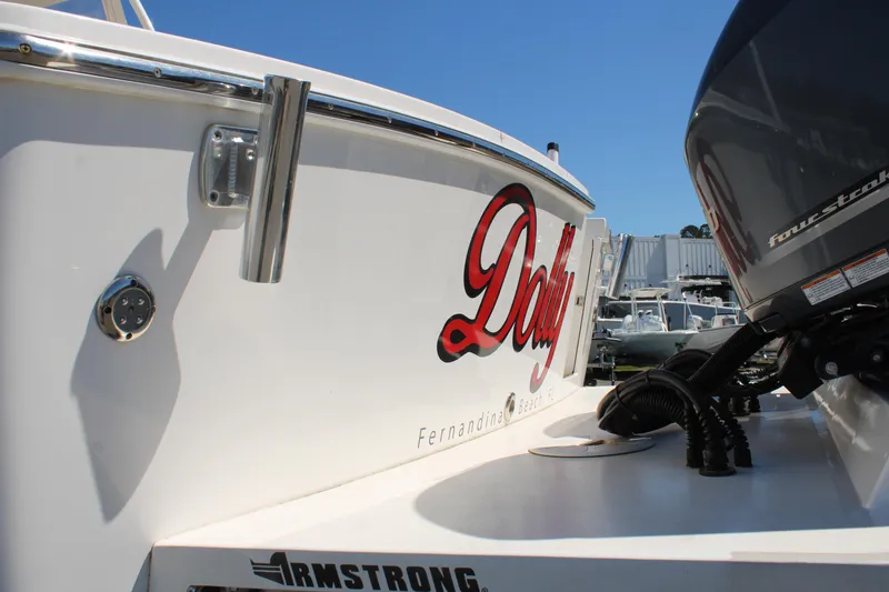 Slide: The Image of 2021 Albemarle 30 Express boat with "Dolly" name, docked under clear blue sky. - 6