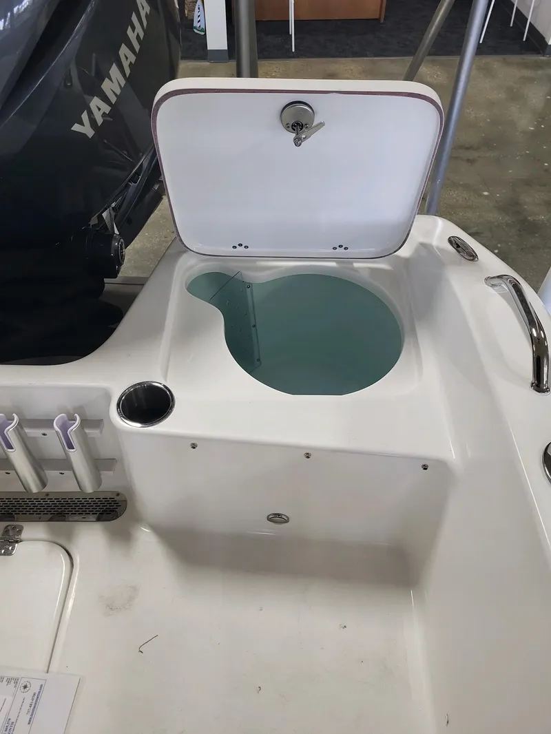 Slide: The Image of 2024 Sea Pro 199 Center Console livewell and storage compartment. - 10