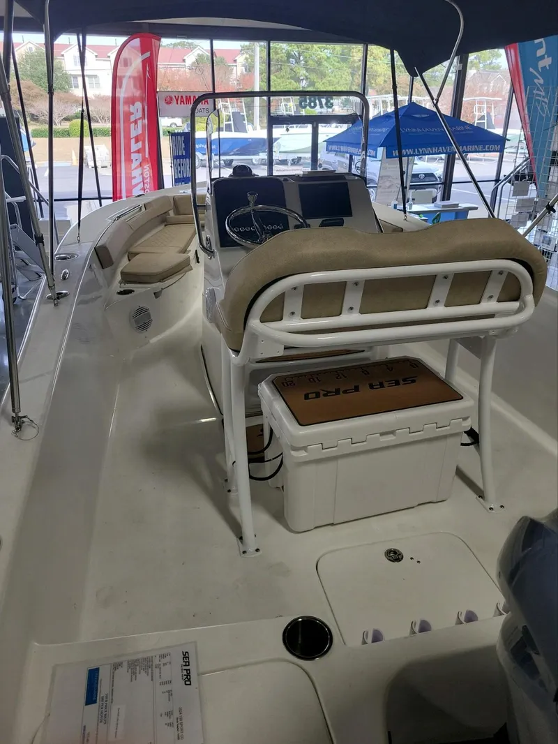 Slide: The Image of 2024 Sea Pro 199 Center Console boat interior with helm and seating. - 3