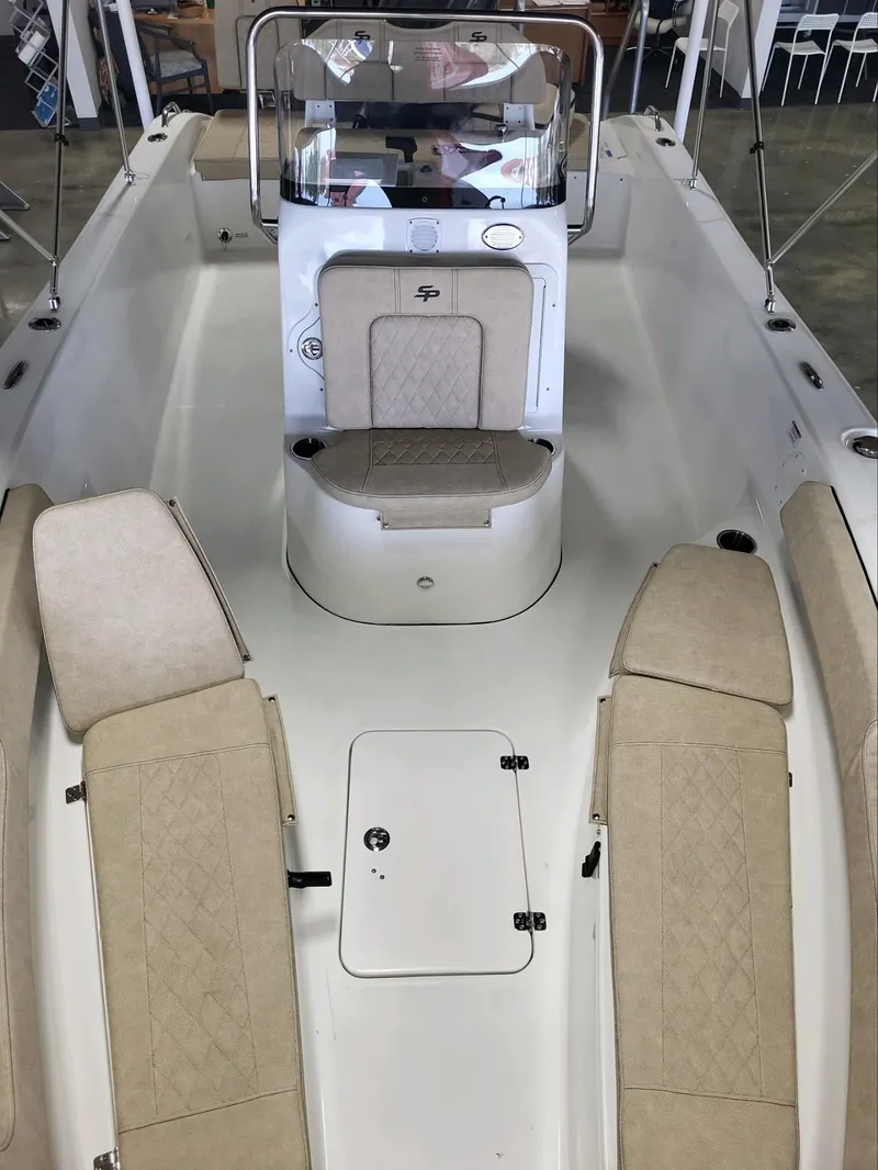 Slide: The Image of 2024 Sea Pro 199 Center Console boat interior with cushioned seating and console. - 5