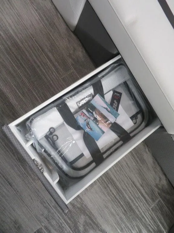 Slide: The Image of Storage compartment in 2024 Crest Classic LX 220 SLRC boat. - 2