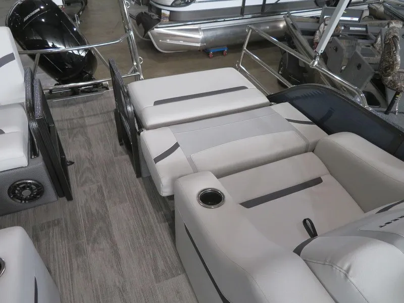 Slide: The Image of 2024 Crest Classic LX 220 SLRC pontoon boat interior with gray seating and flooring. - 7