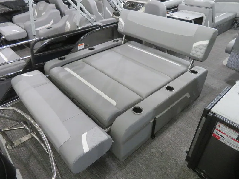 Slide: The Image of 2024 Crest Classic DLX 220 SLSC boat with spacious, adjustable seating and cup holders. - 14