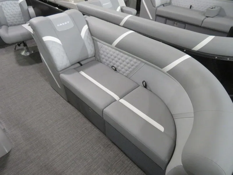 Slide: The Image of 2024 Crest Classic DLX 220 SLSC boat interior with gray cushioned seating. - 3