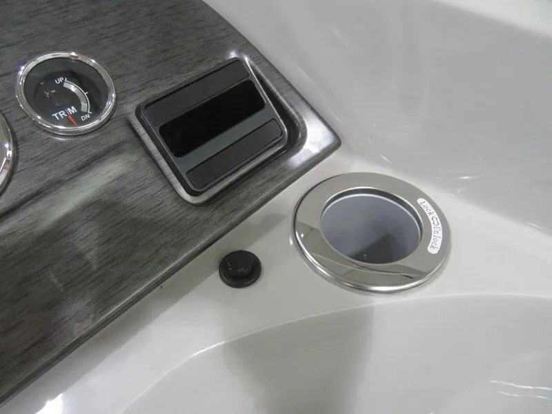 Slide: The Image of 2024 Crest Classic DLX 220 SLSC dashboard with trim gauge and cup holder. - 6