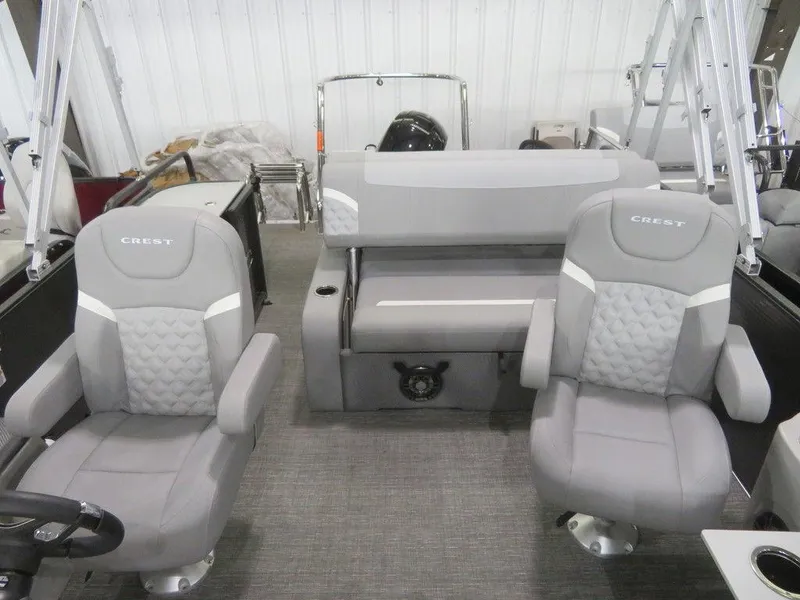 Slide: The Image of 2024 Crest Classic DLX 220 SLSC boat interior with grey seating. - 8