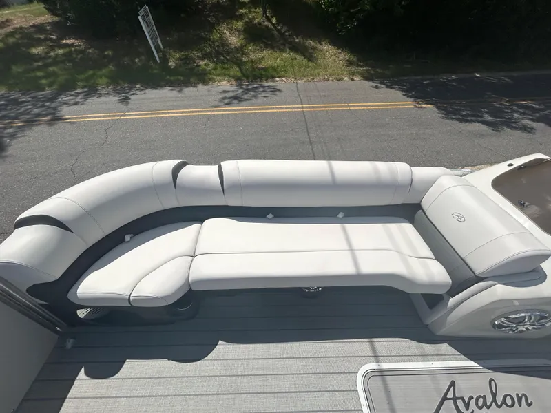 Slide: The Image of 2023 Avalon 2785 ENT FS boat with luxurious white seating. - 11