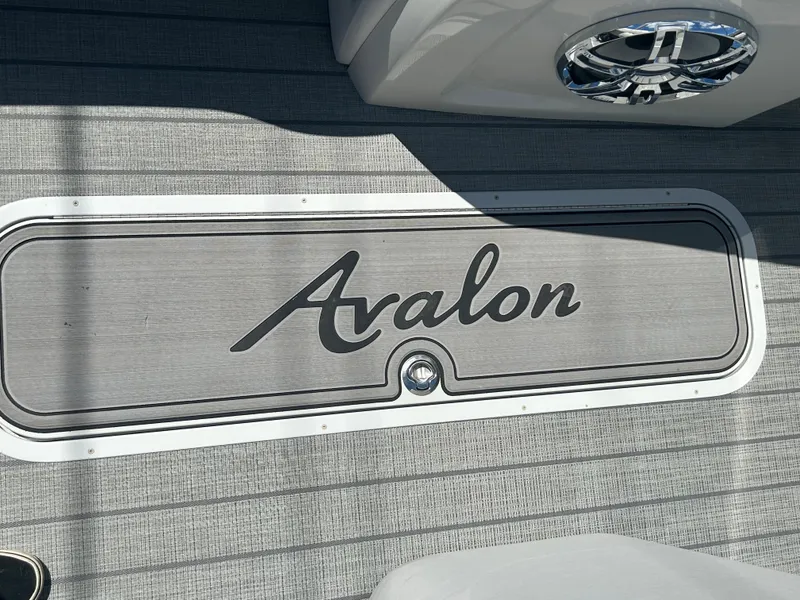 Slide: The Image of 2023 Avalon 2785 ENT FS boat deck with logo. - 12
