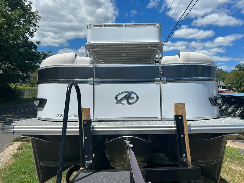 Slide: The Image of 2023 Avalon 2785 ENT FS pontoon boat on trailer, rear view. - 2