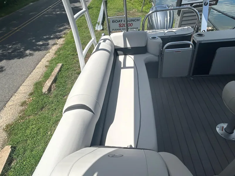 Slide: The Image of 2023 Avalon 2785 ENT FS boat interior with seating and deck view. - 22
