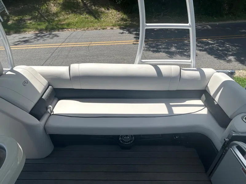 Slide: The Image of 2023 Avalon 2785 ENT FS boat with white cushioned seating. - 23