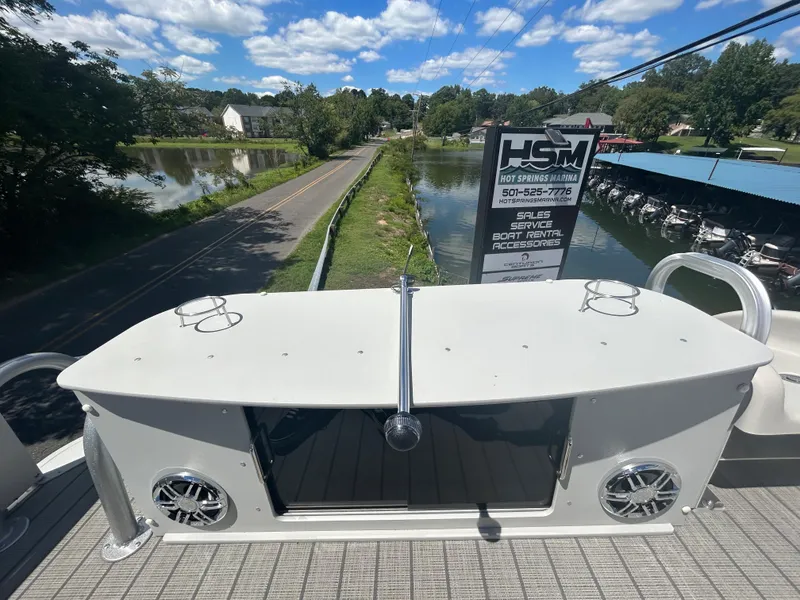Slide: The Image of 2023 Avalon 2785 ENT FS boat docked near a scenic canal. - 30