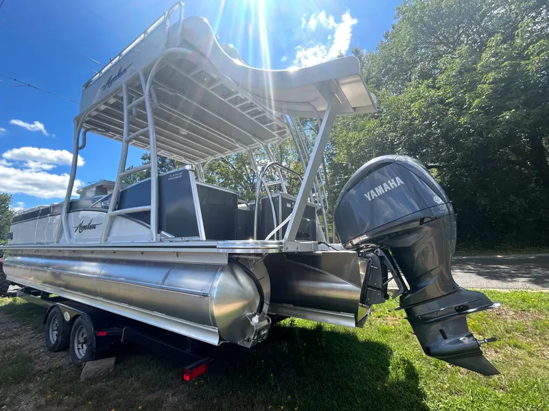 Slide: The Image of 2023 Avalon 2785 ENT FS pontoon boat with Yamaha outboard motor. - 5