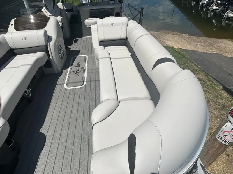 Slide: The Image of 2023 Avalon 2785 ENT FS boat with spacious seating and modern interior design. - 8