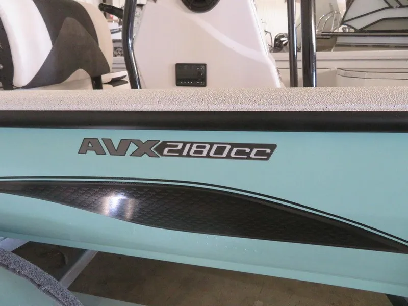 Slide: The Image of 2024 Vexus AVX2180CC boat model close-up in showroom. - 10