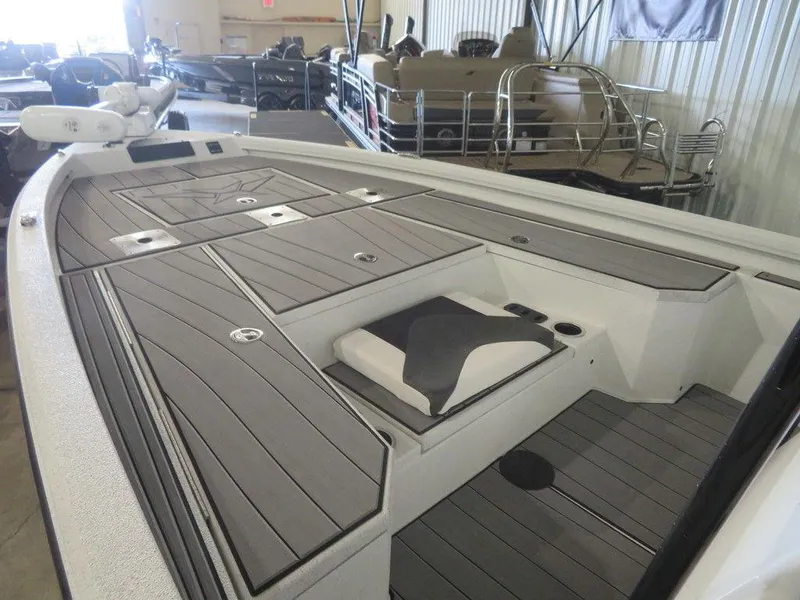 Slide: The Image of 2024 Vexus AVX2180CC boat interior with storage compartments and seating. - 15