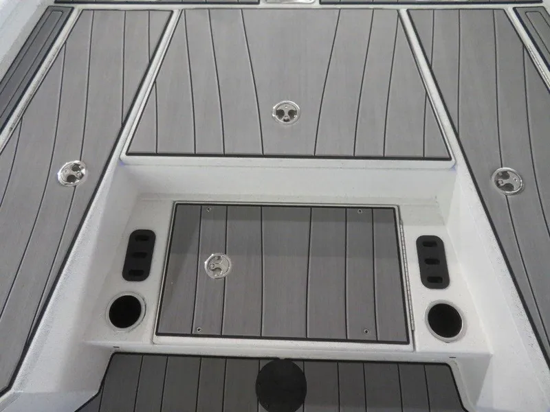 Slide: The Image of 2024 Vexus AVX2180CC boat deck with storage compartments and cup holders. - 21