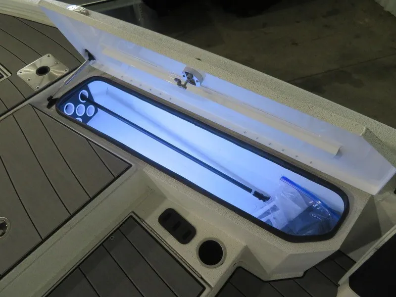 Slide: The Image of 2024 Vexus AVX2180CC boat storage compartment with LED lighting. - 22