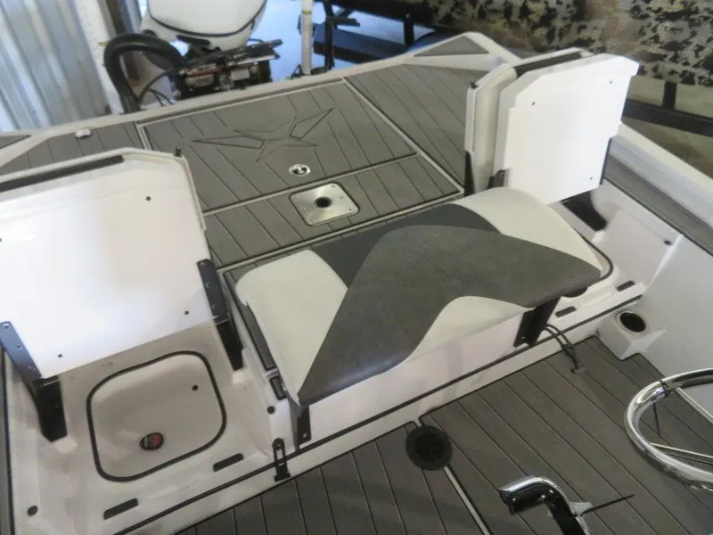 Slide: The Image of 2024 Vexus AVX2180CC boat interior with seating and storage compartments. - 25
