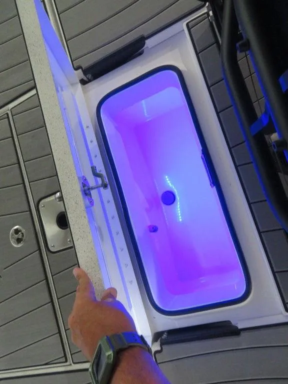 Slide: The Image of 2024 Vexus AVX2180CC boat livewell with blue LED lighting. - 26