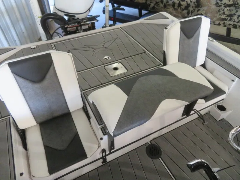Slide: The Image of 2024 Vexus AVX2180CC boat interior with dual seats and storage compartments. - 27