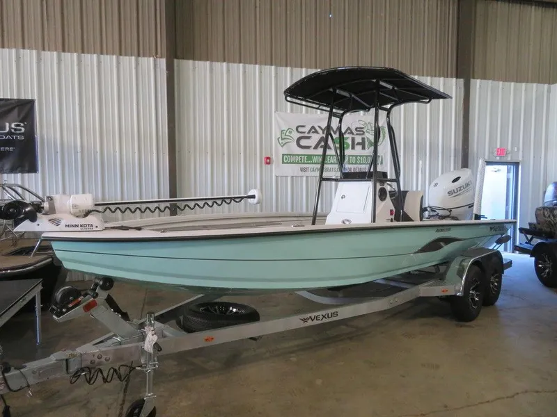 Slide: The Image of 2024 Vexus AVX2180CC boat on trailer in indoor showroom. - 3