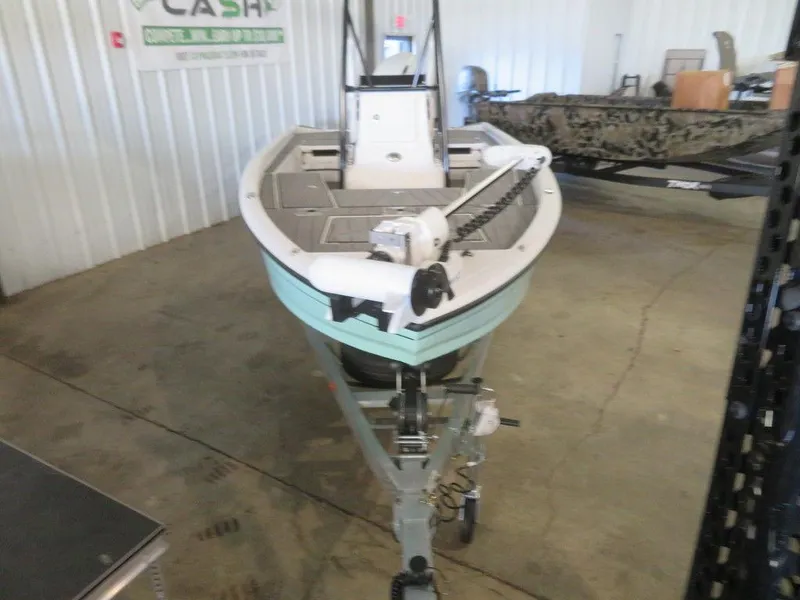 Slide: The Image of 2024 Vexus AVX2180CC boat on trailer in indoor showroom. - 6