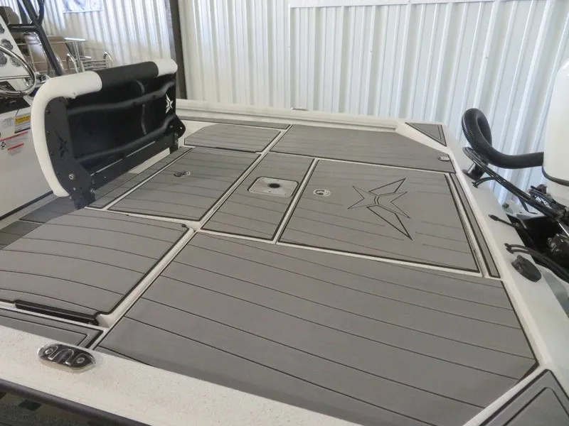 Slide: The Image of 2024 Vexus AVX2180CC boat deck with storage compartments and cushioned seating. - 8