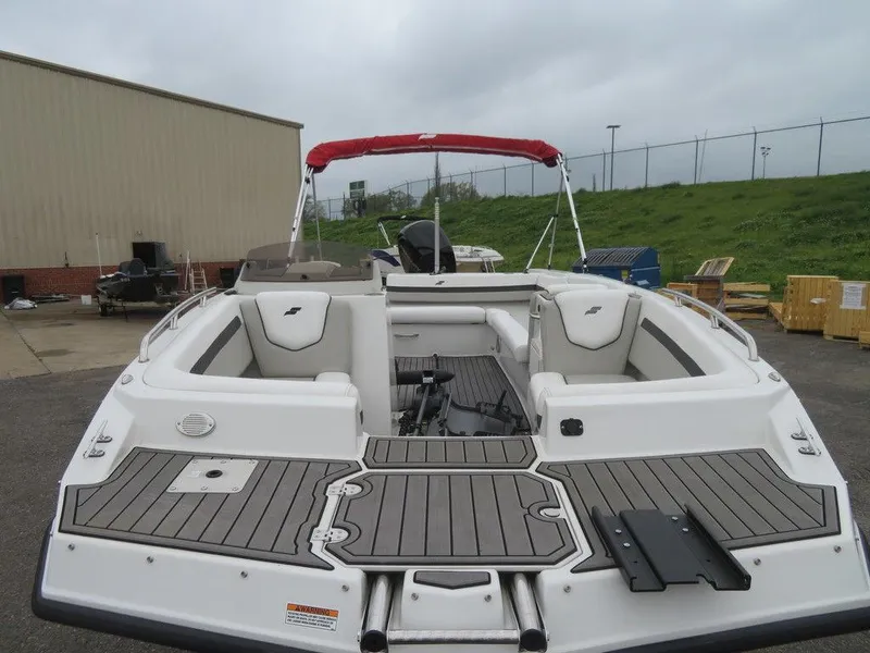 Slide: The Image of 2022 Starcraft SVX211 OB boat with red canopy and spacious seating. - 3