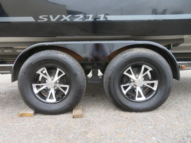 Slide: The Image of 2022 Starcraft SVX211 OB boat trailer with dual black alloy wheels. - 4