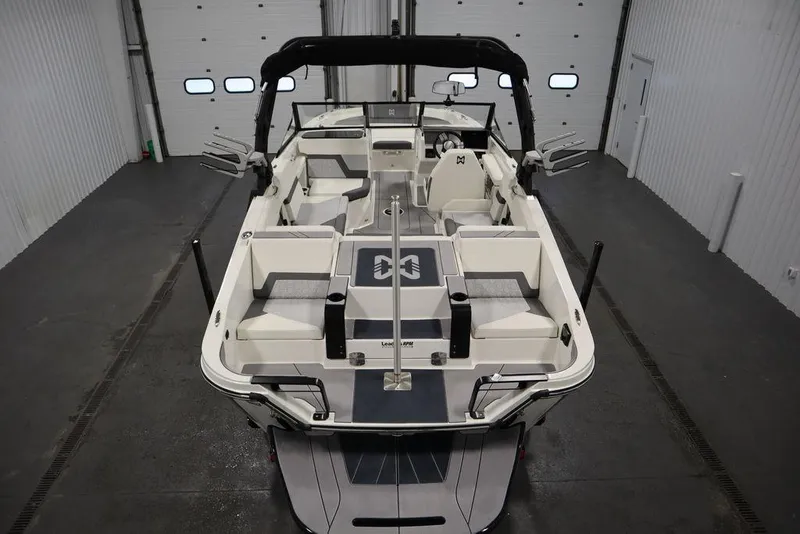 Slide: The Image of 2024 Heyday H20 boat interior with seating, in a garage setting. - 10