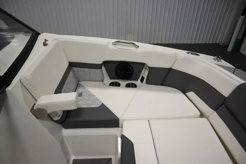 Slide: The Image of 2024 Heyday H20 boat interior with white and gray cushioned seating. - 13