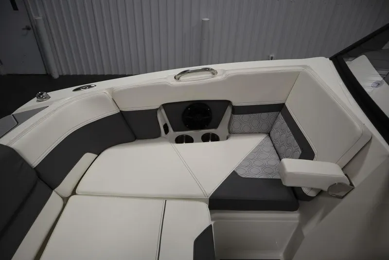 Slide: The Image of 2024 Heyday H20 boat interior with cushioned seating and cup holders. - 15