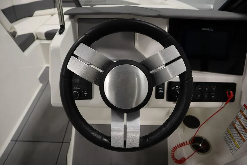 Slide: The Image of 2024 Heyday H20 boat steering wheel and dashboard controls. - 18