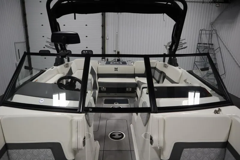 Slide: The Image of 2024 Heyday H20 boat interior with modern seating and steering wheel in a showroom. - 23
